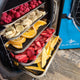 raspberries, bananas, oranges, strawberries and mango going into medium freeze dryer machine on five stainless steel trays
